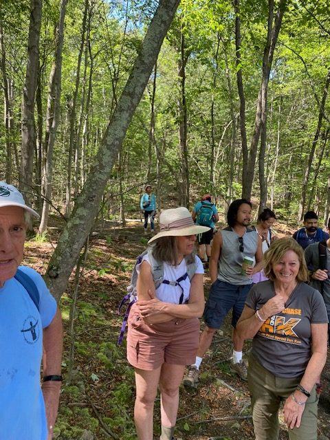 The group gathered on the trail